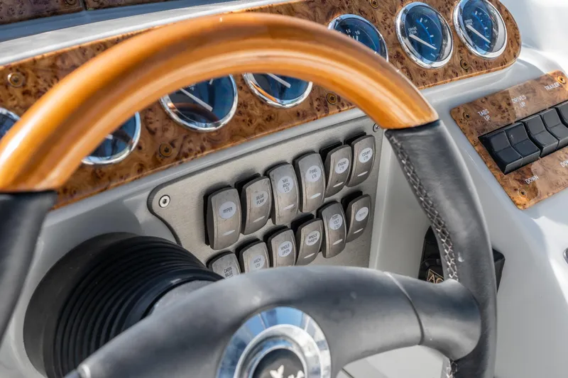 Slide: The Image of Steering wheel and dashboard controls of 2007 Formula 400 Super Sport boat. - 34