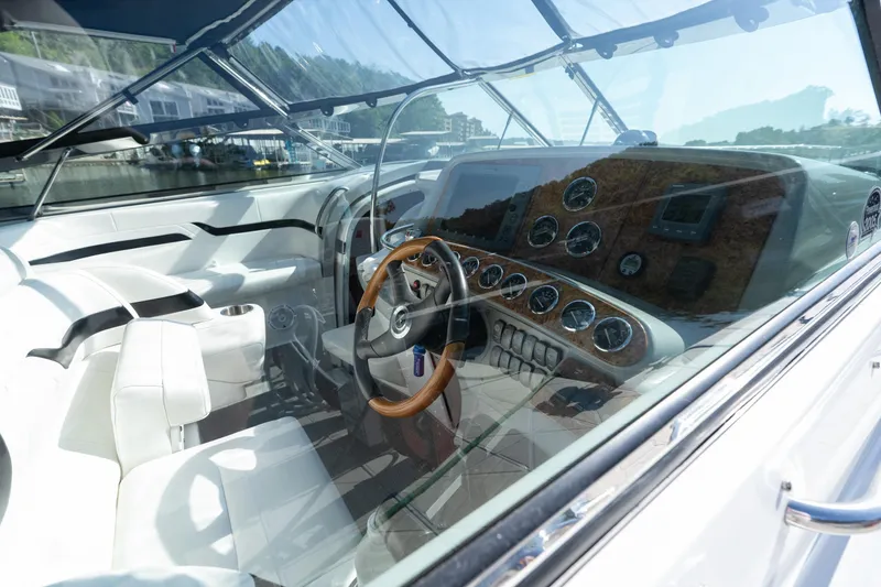 Slide: The Image of Interior view of a 2007 Formula 400 Super Sport boat with sleek dashboard and controls. - 53