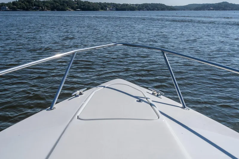 Slide: The Image of Bow view of 2007 Formula 400 Super Sport boat on a serene lake. - 16
