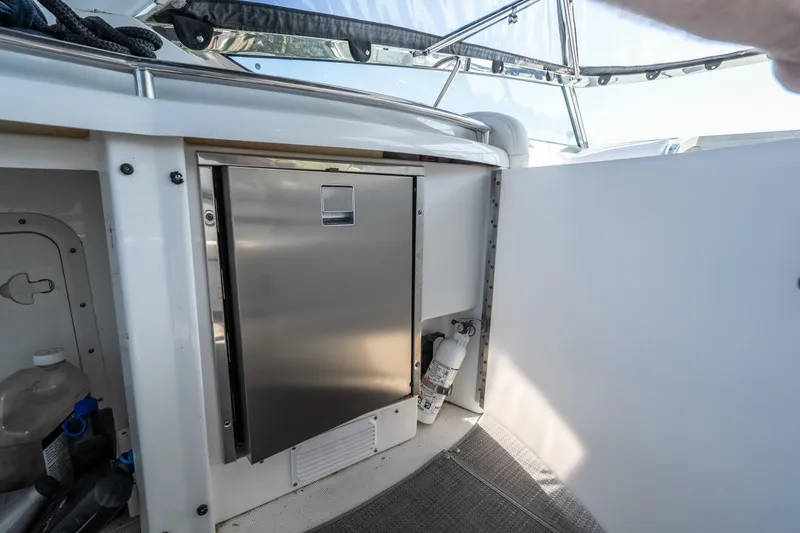 Slide: The Image of 2007 Formula 400 Super Sport boat interior with stainless steel fridge and storage area. - 60