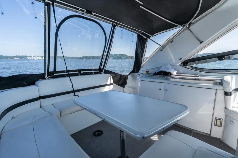 Slide: The Image of Interior of 2007 Formula 400 Super Sport yacht with seating and table, overlooking water. - 28