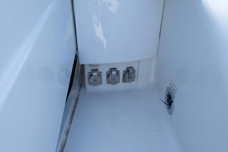 Slide: The Image of 2007 Formula 400 Super Sport boat deck with utility ports and clean white surface. - 56