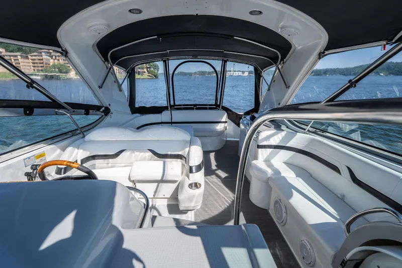 Slide: The Image of Interior view of 2007 Formula 400 Super Sport boat with seating and lake backdrop. - 19