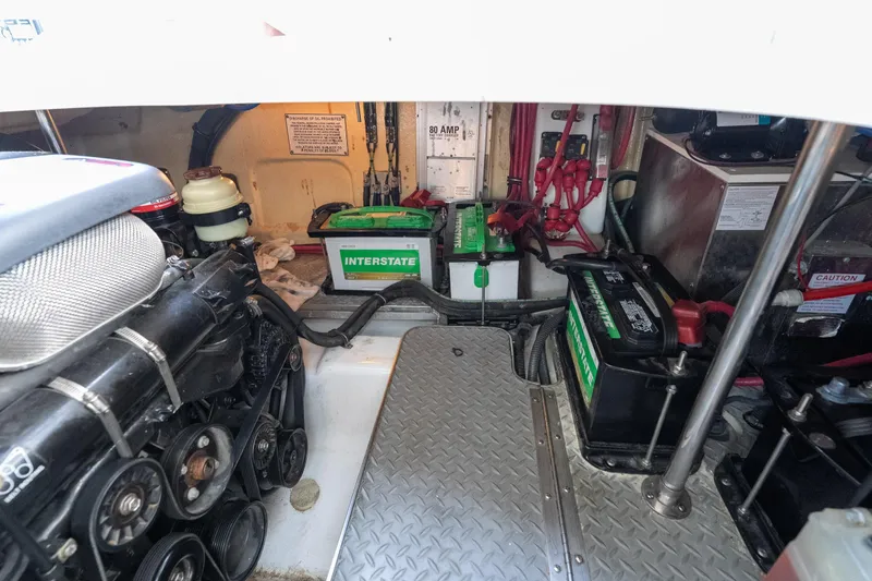 Slide: The Image of Engine compartment of a 2007 Formula 400 Super Sport with Interstate batteries and mechanical components. - 51