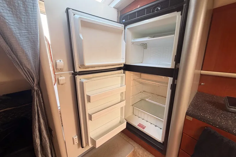 Slide: The Image of Open refrigerator inside a 2007 Formula 400 Super Sport boat cabin. - 41