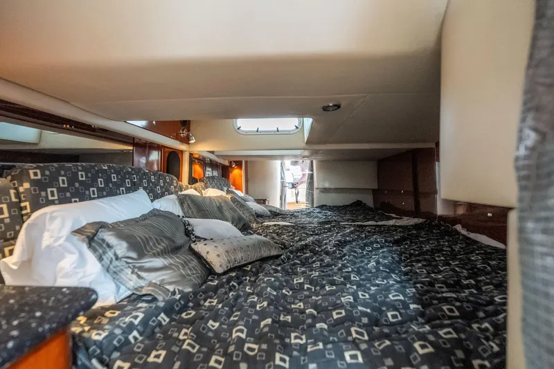 Slide: The Image of Luxurious cabin interior of 2007 Formula 400 Super Sport yacht with plush bedding. - 48