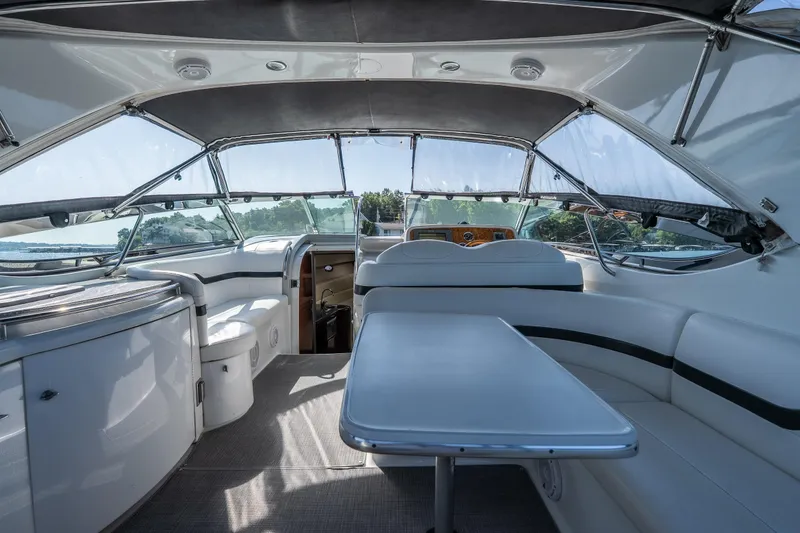 Slide: The Image of Interior of a 2007 Formula 400 Super Sport yacht, featuring sleek seating and a modern helm. - 29