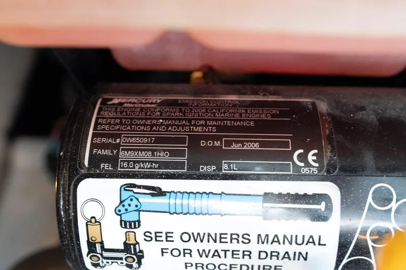 Slide: The Image of Close-up of a 2007 Formula 400 Super Sport engine label with specifications. - 58