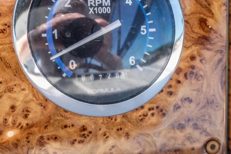 Slide: The Image of Close-up of a 2007 Formula 400 Super Sport RPM gauge on a wooden dashboard. - 36