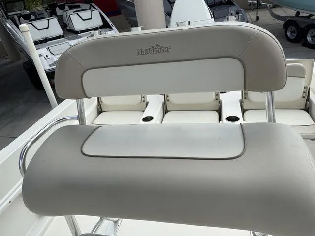 Slide: The Image of A beige seat cushion on a boat with the "NauticStar" logo. - 4