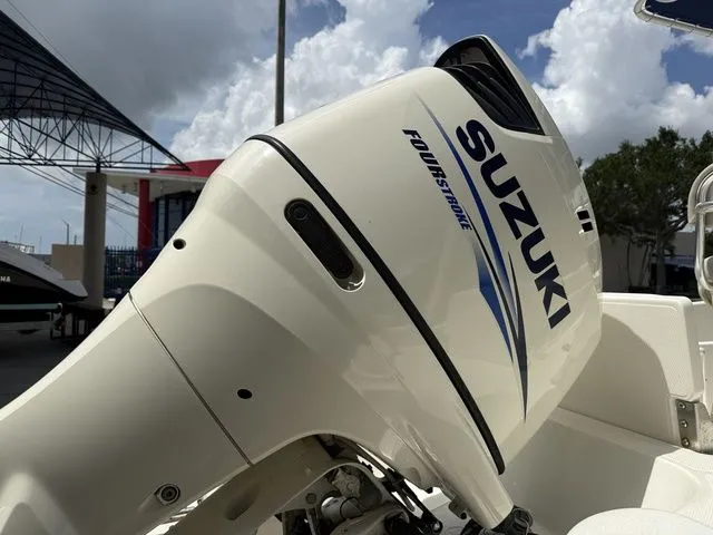 The Image of Close-up of a Suzuki four-stroke outboard motor on a boat. - 1