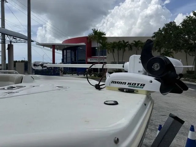 Slide: The Image of A Minn Kota trolling motor is mounted on a boat, which is on land. - 2