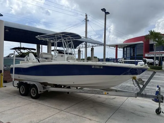 Slide: The Image of 2015 NauticStar 231 Coastal on a trailer, parked on land. - 9