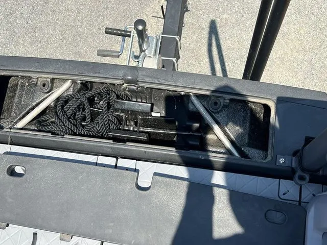 Slide: The Image of An open storage compartment on a 2022 Sea-Doo Switch Cruise 18 with ropes and equipment. - 20