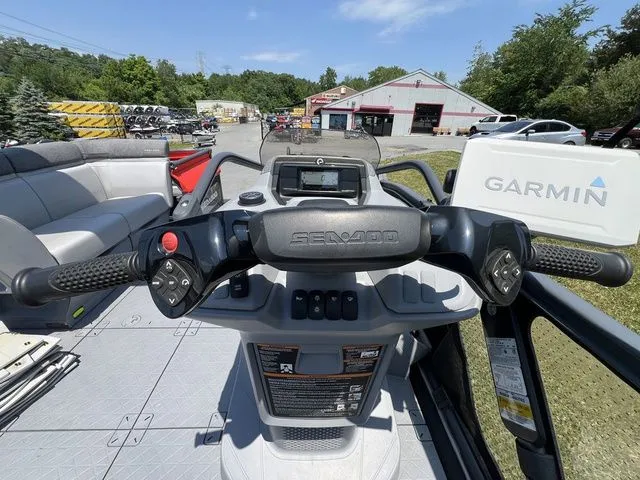 Slide: The Image of The image shows the helm of a 2022 Sea-Doo Switch Cruise 18. - 16