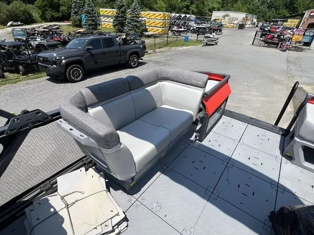 Slide: The Image of The image shows the deck of a 2022 Sea-Doo Switch Cruise 18 with a gray seating area. - 17