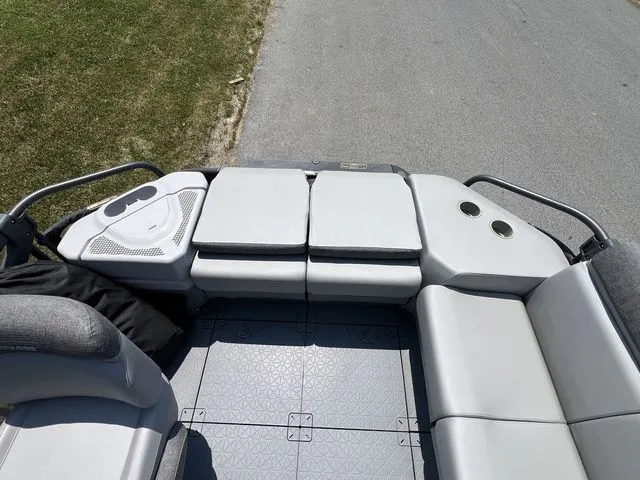 Slide: The Image of The image shows the deck of a 2022 Sea-Doo Switch Cruise 18 with gray seating. - 12