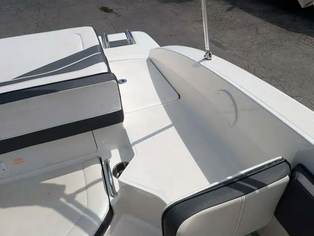 Slide: The Image of The image shows the cockpit of a 2017 Sea Ray SPX 190 boat with white and gray seating. - 7