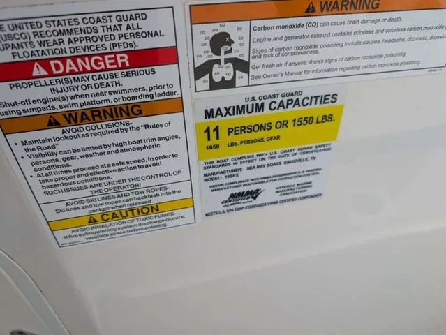 Slide: The Image of Warning labels and capacity information for a Sea Ray SPX 190 boat. - 4