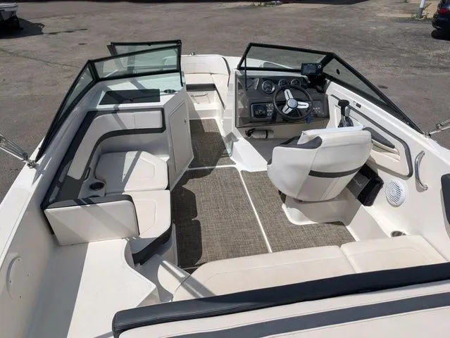 Slide: The Image of Interior view of a 2017 Sea Ray SPX 190 boat with seating and helm console. - 11