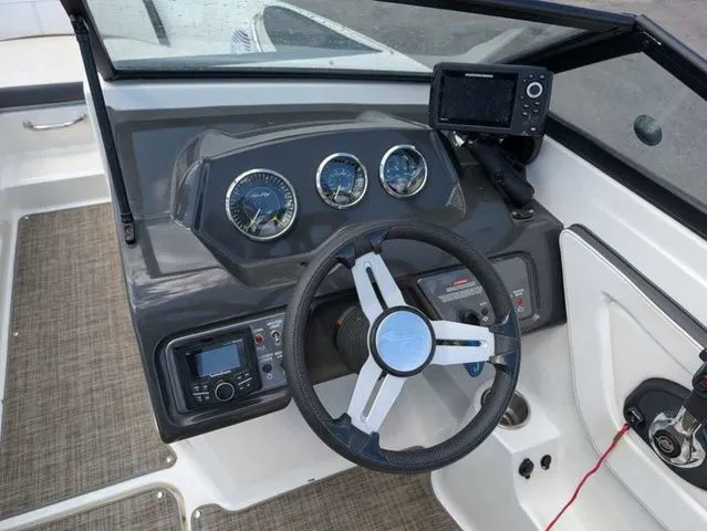 Slide: The Image of The image shows the cockpit of a 2017 Sea Ray SPX 190 boat with steering wheel and instruments. - 3