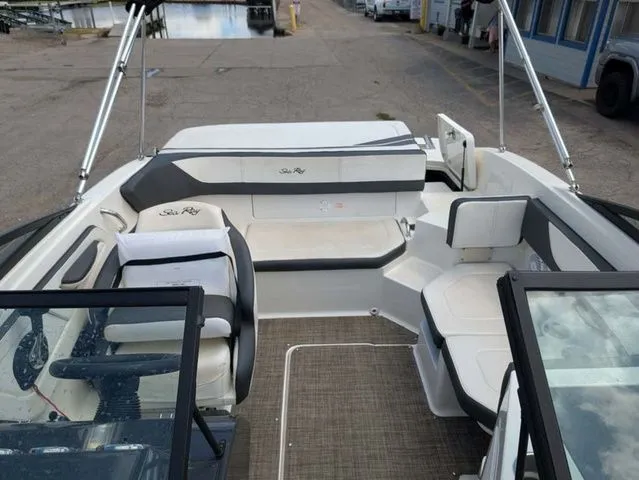 Slide: The Image of The image shows the cockpit of a 2017 Sea Ray SPX 190 boat with seating areas. - 6