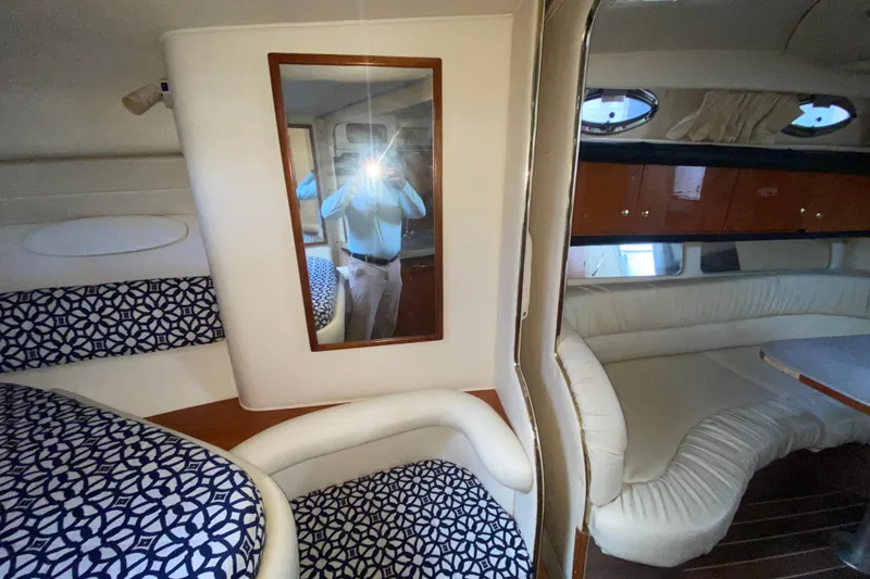 Slide: The Image of Interior of 2001 Sea Ray 340 Sundancer with patterned seating and mirror reflection. - 35