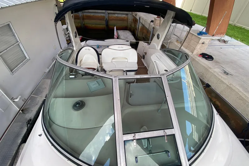 Slide: The Image of 2001 Sea Ray 340 Sundancer boat with spacious cockpit and sleek design. - 11