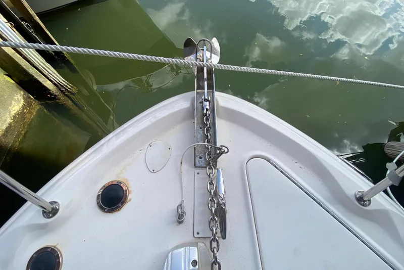 Slide: The Image of 2001 Sea Ray 340 Sundancer anchor chain and deck detail by the water. - 10