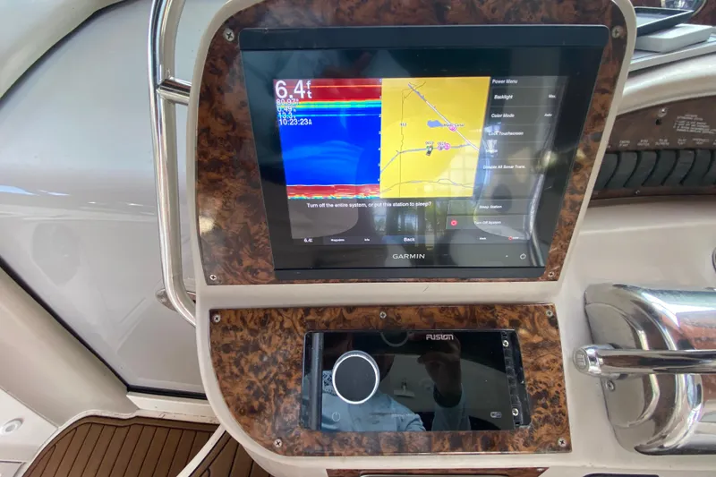 Slide: The Image of Garmin navigation system on 2001 Sea Ray 340 Sundancer boat dashboard. - 24