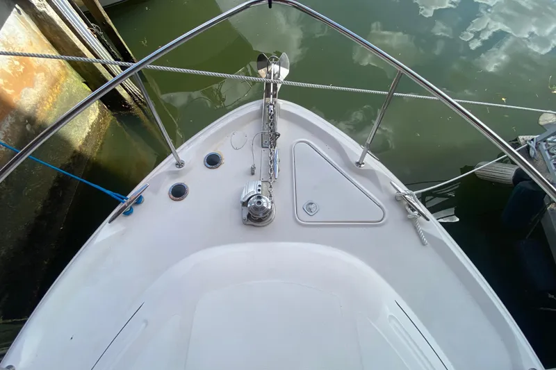 Slide: The Image of Bow view of 2001 Sea Ray 340 Sundancer yacht with anchor and railing. - 9