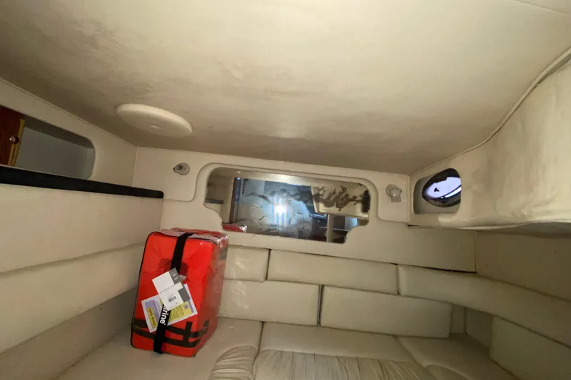 Slide: The Image of Interior cabin of 2001 Sea Ray 340 Sundancer with life jacket storage. - 41
