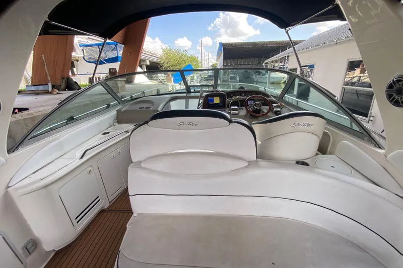 Slide: The Image of 2001 Sea Ray 340 Sundancer boat interior with helm and seating area. - 18