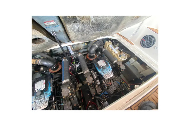 Slide: The Image of Engine compartment of a 2001 Sea Ray 340 Sundancer boat, showcasing dual engines. - 47