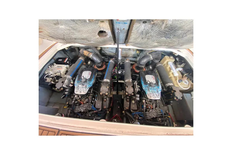 Slide: The Image of Engine compartment of a 2001 Sea Ray 340 Sundancer boat, showcasing dual engines. - 48