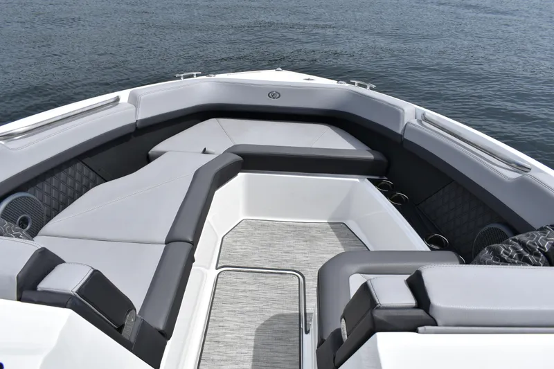 Slide: The Image of 2023 Cobalt R8 boat interior with luxurious seating on calm water. - 15
