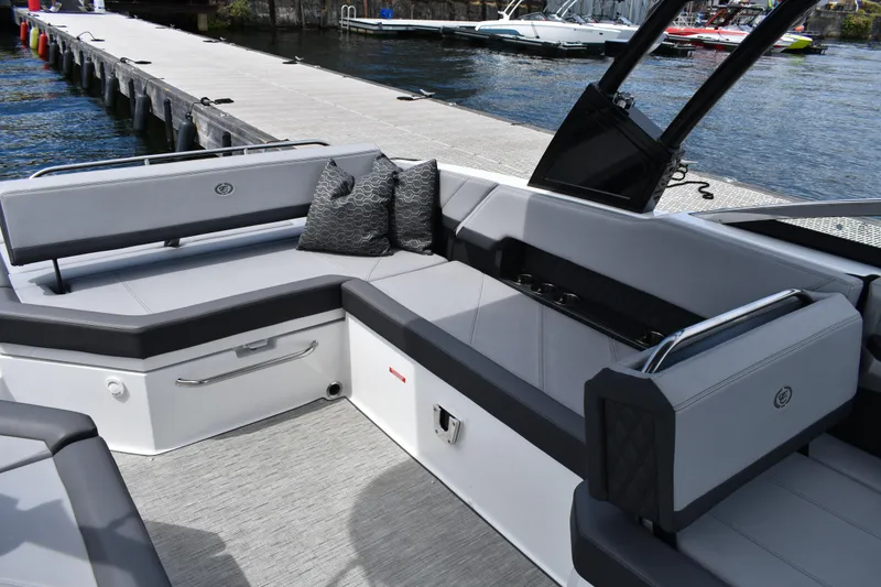 Slide: The Image of Luxurious seating area on a 2023 Cobalt R8 boat docked by the water. - 19