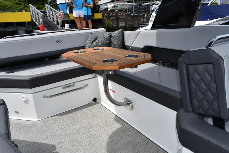 Slide: The Image of Luxurious interior of 2023 Cobalt R8 boat with elegant seating and wooden table. - 23