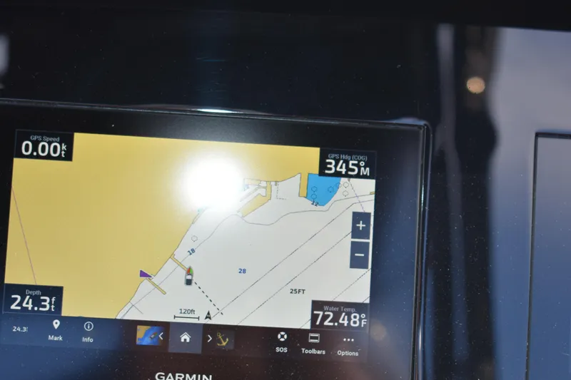 Slide: The Image of Garmin navigation display on 2023 Cobalt R8 showing GPS speed, heading, and water temperature. - 12