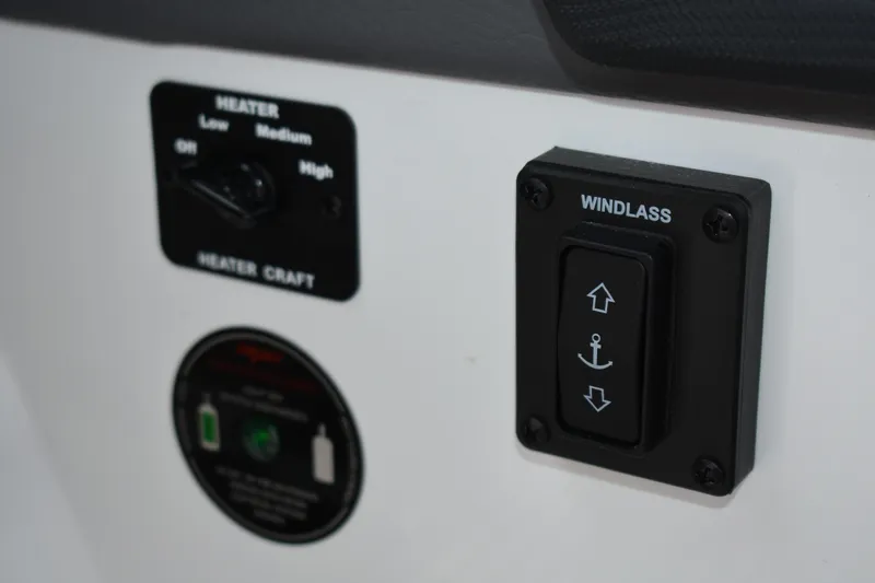 Slide: The Image of Control panel of 2023 Cobalt R8 featuring heater and windlass switches. - 14