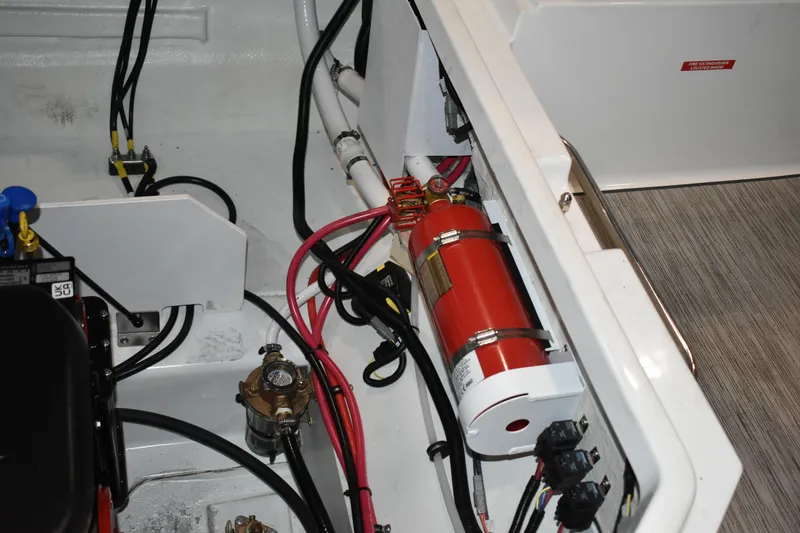 Slide: The Image of Engine compartment of 2023 Cobalt R8 boat with fire extinguisher and wiring. - 36