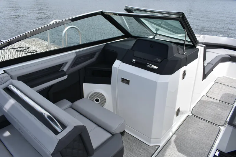 Slide: The Image of 2023 Cobalt R8 boat interior with sleek seating and modern dashboard design. - 10