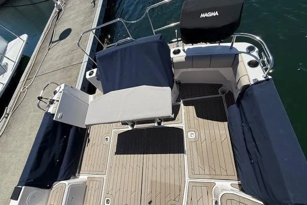 Slide: The Image of 2023 Cutwater C-30 Sedan boat deck with seating and Magma grill cover. - 24