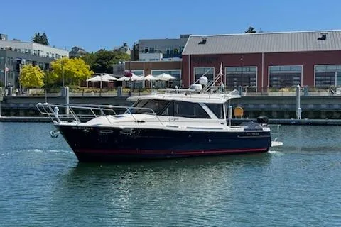 Slide: The Image of 2023 Cutwater C-30 Sedan boat docked in a marina under clear blue skies. - 3