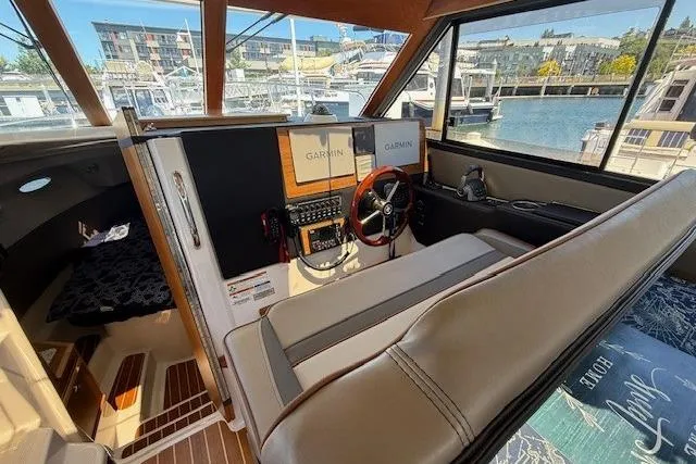 Slide: The Image of Interior of 2023 Cutwater C-30 Sedan boat with modern navigation equipment and comfortable seating. - 20