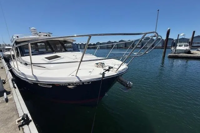 Slide: The Image of 2023 Cutwater C-30 Sedan docked at marina, showcasing sleek design and modern features. - 10