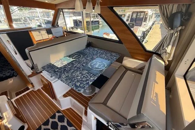 Slide: The Image of Interior of 2023 Cutwater C-30 Sedan with elegant seating and nautical decor. - 13
