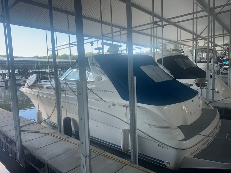 Slide: The Image of A 1997 Sea Ray Sundancer 370 docked in a covered marina. - 2