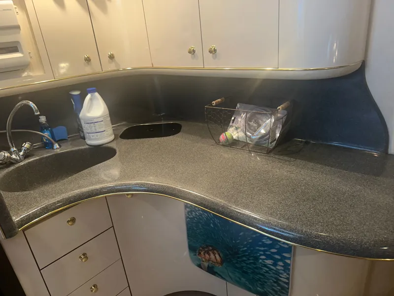 Slide: The Image of Interior of the 1997 Sea Ray Sundancer 370 with curved countertop and sink. - 12