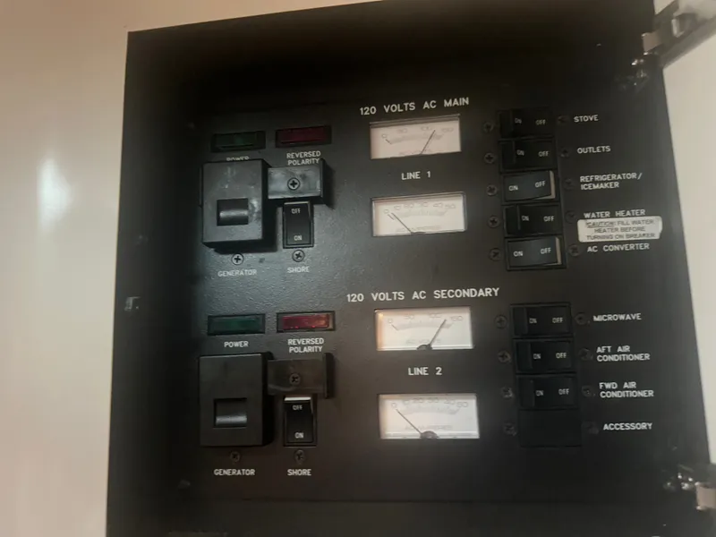Slide: The Image of Electrical control panel on a 1997 Sea Ray Sundancer 370 boat. - 22